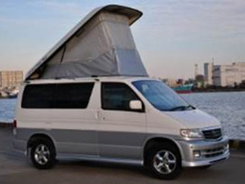side view of a mazda bongo witht he roof up uk