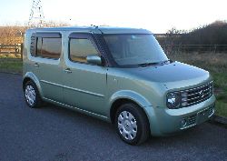 pastel green nissan cube